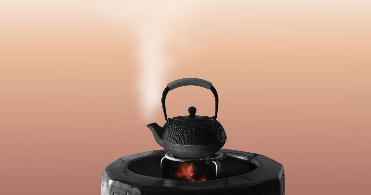 Steaming cast-iron kettle on a hot stove, representing AI-era workplace stress and employee burnout